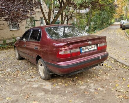 Червоний Тойота Carina E, об'ємом двигуна 1.6 л та пробігом 220 тис. км за 1500 $, фото 7 на Automoto.ua