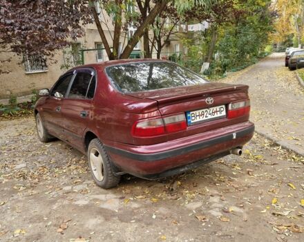 Червоний Тойота Carina E, об'ємом двигуна 1.6 л та пробігом 220 тис. км за 1500 $, фото 3 на Automoto.ua