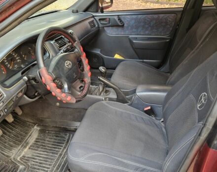 Червоний Тойота Carina E, об'ємом двигуна 1.6 л та пробігом 220 тис. км за 1500 $, фото 9 на Automoto.ua