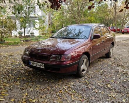 Червоний Тойота Carina E, об'ємом двигуна 1.6 л та пробігом 220 тис. км за 1500 $, фото 1 на Automoto.ua