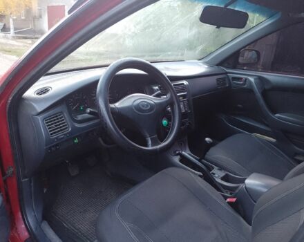 Червоний Тойота Carina E, об'ємом двигуна 1.6 л та пробігом 111 тис. км за 2000 $, фото 6 на Automoto.ua