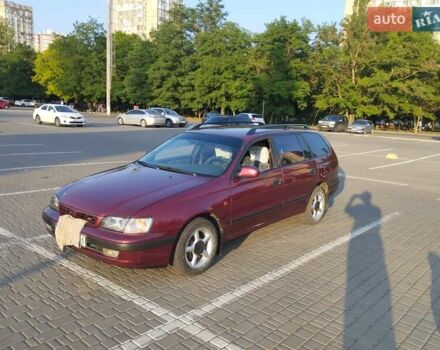 Красный Тойота Carina E, объемом двигателя 2 л и пробегом 450 тыс. км за 3700 $, фото 1 на Automoto.ua