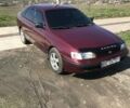 Червоний Тойота Carina E, об'ємом двигуна 1.8 л та пробігом 386 тис. км за 3000 $, фото 3 на Automoto.ua