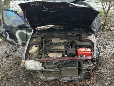 Красный Тойота Carina E, объемом двигателя 1.6 л и пробегом 435 тыс. км за 828 $, фото 1 на Automoto.ua