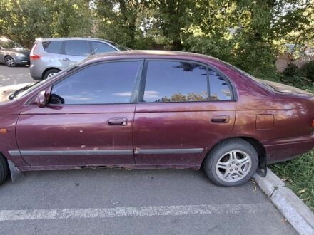 Червоний Тойота Carina E, об'ємом двигуна 0 л та пробігом 218 тис. км за 2100 $, фото 1 на Automoto.ua