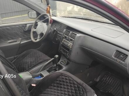 Червоний Тойота Carina E, об'ємом двигуна 1.8 л та пробігом 500 тис. км за 1600 $, фото 1 на Automoto.ua