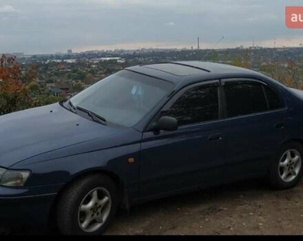 Синій Тойота Carina E, об'ємом двигуна 2 л та пробігом 397 тис. км за 4750 $, фото 3 на Automoto.ua