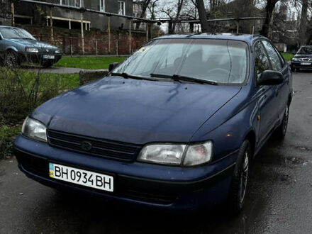 Синій Тойота Carina E, об'ємом двигуна 2 л та пробігом 188 тис. км за 1750 $, фото 1 на Automoto.ua