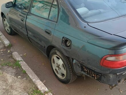 Синій Тойота Carina E, об'ємом двигуна 2 л та пробігом 210 тис. км за 1300 $, фото 1 на Automoto.ua