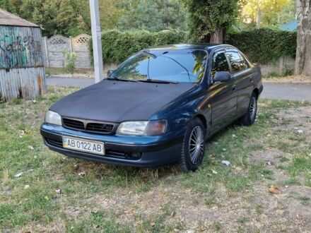 Зелений Тойота Carina E, об'ємом двигуна 1.8 л та пробігом 350 тис. км за 1100 $, фото 1 на Automoto.ua