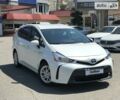 Білий Тойота Prius v, об'ємом двигуна 1.8 л та пробігом 257 тис. км за 15800 $, фото 1 на Automoto.ua