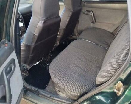 Зеленый ВАЗ 2111, объемом двигателя 1.5 л и пробегом 350 тыс. км за 1400 $, фото 4 на Automoto.ua