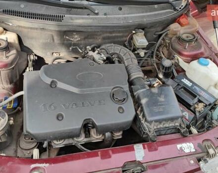 Красный ВАЗ 2112, объемом двигателя 1.5 л и пробегом 340 тыс. км за 2099 $, фото 14 на Automoto.ua