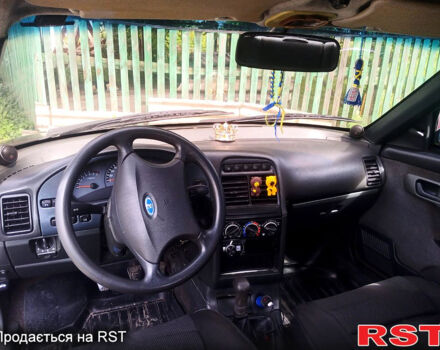 Красный ВАЗ 2112, объемом двигателя 1.6 л и пробегом 250 тыс. км за 1670 $, фото 4 на Automoto.ua