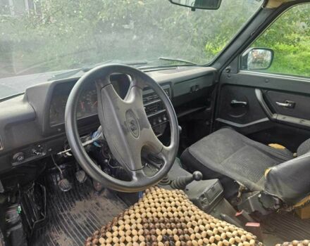 Зелений ВАЗ 21214, об'ємом двигуна 1.7 л та пробігом 300 тис. км за 1787 $, фото 9 на Automoto.ua