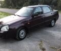 Красный ВАЗ 2170 Priora, объемом двигателя 1.6 л и пробегом 124 тыс. км за 1450 $, фото 1 на Automoto.ua
