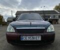 Красный ВАЗ 2170 Priora, объемом двигателя 1.6 л и пробегом 200 тыс. км за 1950 $, фото 1 на Automoto.ua