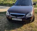 Красный ВАЗ 2170 Priora, объемом двигателя 1.6 л и пробегом 220 тыс. км за 2900 $, фото 1 на Automoto.ua