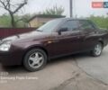 Красный ВАЗ 2170 Priora, объемом двигателя 1.6 л и пробегом 121 тыс. км за 4050 $, фото 1 на Automoto.ua