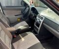 Красный ВАЗ Priora, объемом двигателя 1.6 л и пробегом 177 тыс. км за 2000 $, фото 8 на Automoto.ua