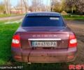 Червоний ВАЗ Priora, об'ємом двигуна 1.6 л та пробігом 261 тис. км за 1950 $, фото 1 на Automoto.ua