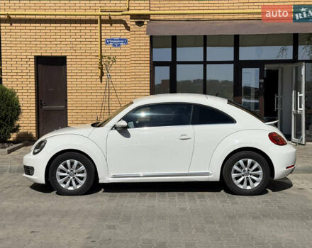 Белый Фольксваген Битл, объемом двигателя 1.4 л и пробегом 145 тыс. км за 9800 $, фото 1 на Automoto.ua
