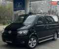 Чорний Фольксваген Мультиван, об'ємом двигуна 2 л та пробігом 311 тис. км за 21499 $, фото 1 на Automoto.ua