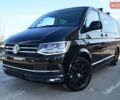 Чорний Фольксваген Мультиван, об'ємом двигуна 2 л та пробігом 216 тис. км за 41555 $, фото 2 на Automoto.ua