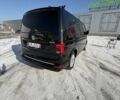 Чорний Фольксваген Мультиван, об'ємом двигуна 2 л та пробігом 73 тис. км за 59980 $, фото 2 на Automoto.ua