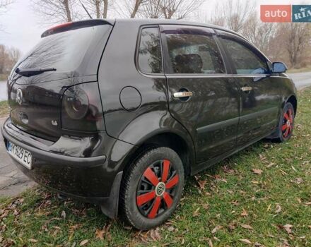 Черный Фольксваген Поло, объемом двигателя 1.4 л и пробегом 170 тыс. км за 5900 $, фото 6 на Automoto.ua