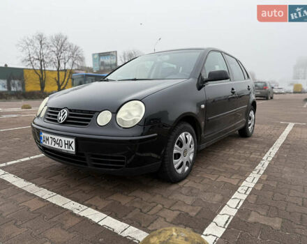 Черный Фольксваген Поло, объемом двигателя 1.2 л и пробегом 208 тыс. км за 4000 $, фото 1 на Automoto.ua
