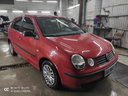 Красный Фольксваген Поло, объемом двигателя 1.4 л и пробегом 213 тыс. км за 3900 $, фото 1 на Automoto.ua