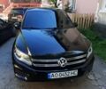 Чорний Фольксваген Тігуан, об'ємом двигуна 2 л та пробігом 215 тис. км за 10800 $, фото 1 на Automoto.ua