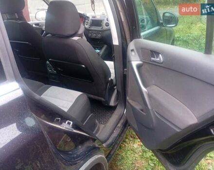 Черный Фольксваген Тигуан, объемом двигателя 1.4 л и пробегом 300 тыс. км за 9300 $, фото 1 на Automoto.ua