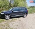 Черный Фольксваген Тигуан, объемом двигателя 1.4 л и пробегом 256 тыс. км за 8300 $, фото 1 на Automoto.ua