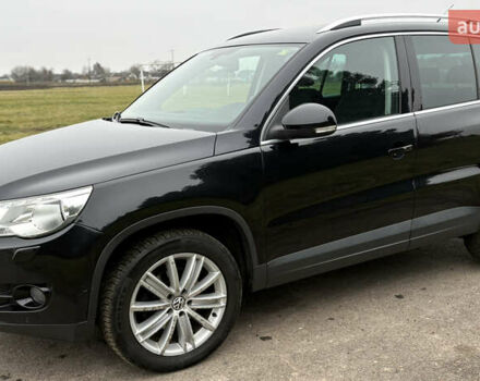 Черный Фольксваген Тигуан, объемом двигателя 1.39 л и пробегом 213 тыс. км за 9399 $, фото 1 на Automoto.ua