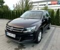 Черный Фольксваген Тигуан, объемом двигателя 2 л и пробегом 124 тыс. км за 11800 $, фото 1 на Automoto.ua