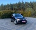 Чорний Фольксваген Тігуан, об'ємом двигуна 1.99 л та пробігом 180 тис. км за 11300 $, фото 2 на Automoto.ua