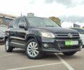 Чорний Фольксваген Тігуан, об'ємом двигуна 2 л та пробігом 150 тис. км за 18799 $, фото 1 на Automoto.ua