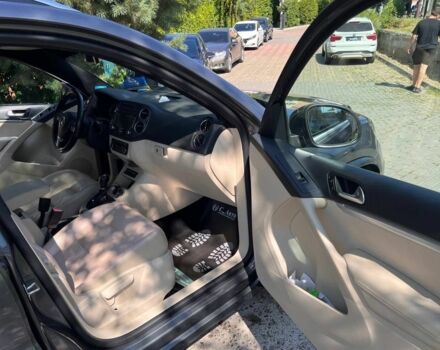 Черный Фольксваген Тигуан, объемом двигателя 1.8 л и пробегом 170 тыс. км за 12700 $, фото 12 на Automoto.ua