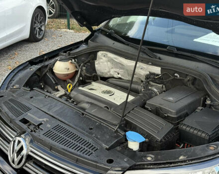 Чорний Фольксваген Тігуан, об'ємом двигуна 2 л та пробігом 180 тис. км за 12600 $, фото 1 на Automoto.ua