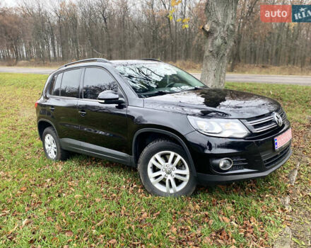 Чорний Фольксваген Тігуан, об'ємом двигуна 1.98 л та пробігом 124 тис. км за 13600 $, фото 1 на Automoto.ua