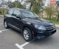 Чорний Фольксваген Тігуан, об'ємом двигуна 2 л та пробігом 180 тис. км за 14700 $, фото 1 на Automoto.ua