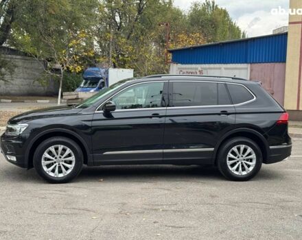Черный Фольксваген Тигуан, объемом двигателя 2 л и пробегом 143 тыс. км за 18690 $, фото 1 на Automoto.ua