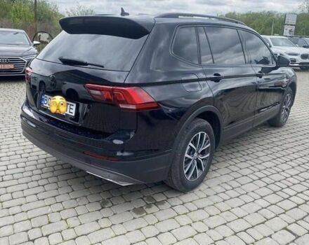 Чорний Фольксваген Тігуан, об'ємом двигуна 2 л та пробігом 131 тис. км за 18500 $, фото 2 на Automoto.ua