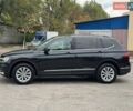 Чорний Фольксваген Тігуан, об'ємом двигуна 2 л та пробігом 143 тис. км за 18690 $, фото 1 на Automoto.ua