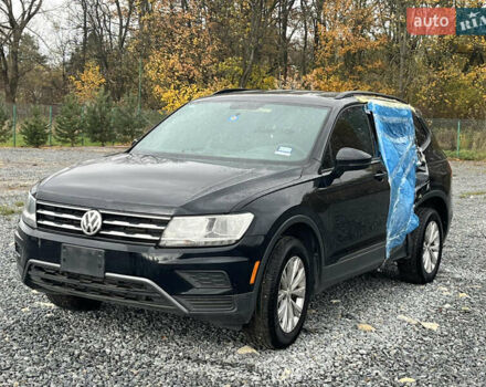 Черный Фольксваген Тигуан, объемом двигателя 2 л и пробегом 160 тыс. км за 12000 $, фото 1 на Automoto.ua