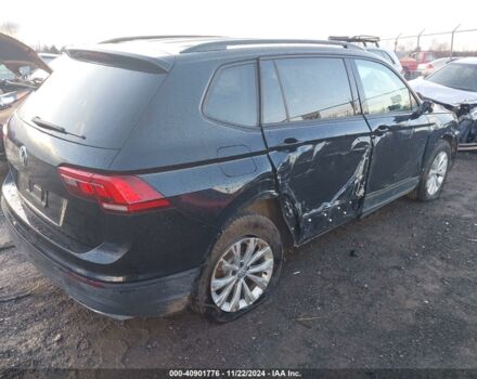 Чорний Фольксваген Тігуан, об'ємом двигуна 2 л та пробігом 115 тис. км за 10100 $, фото 5 на Automoto.ua