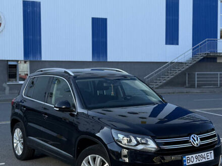 Чорний Фольксваген Тігуан, об'ємом двигуна 2 л та пробігом 165 тис. км за 12300 $, фото 1 на Automoto.ua