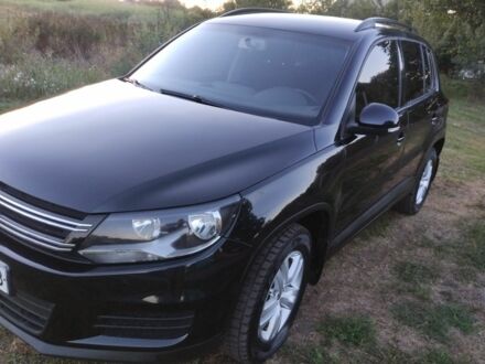 Чорний Фольксваген Тігуан, об'ємом двигуна 2 л та пробігом 370 тис. км за 8600 $, фото 1 на Automoto.ua